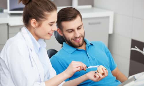 Hygienist demonstrating brushing